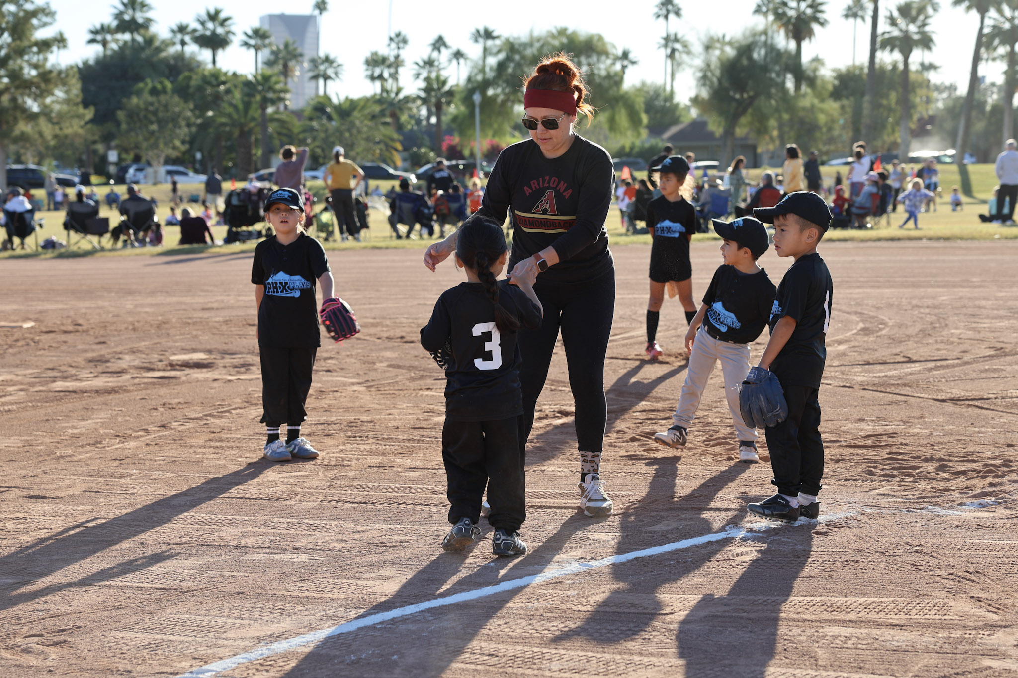Youth Sports coach with tball team.jpg